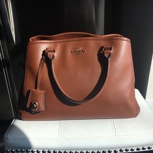 Coach leather satchel with crossbody and key ring.